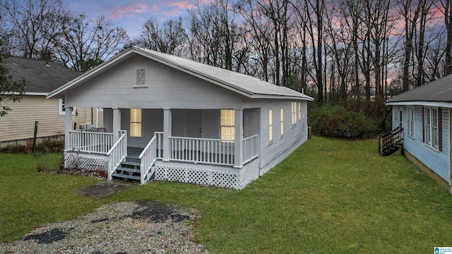 bungalow-style house featuring a yard and a porch