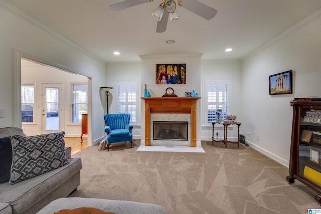 living room with crown molding, plenty of natural light, and carpet flooring