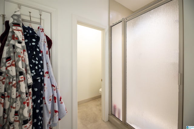 bathroom with a shower with shower door