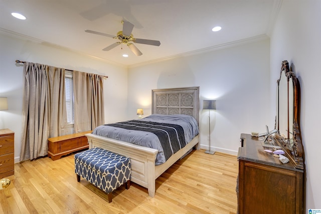 bedroom with ornamental molding, ceiling fan, and light wood-type flooring