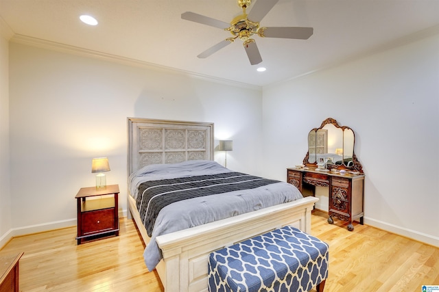 bedroom featuring ceiling fan, ornamental molding, and hardwood / wood-style floors