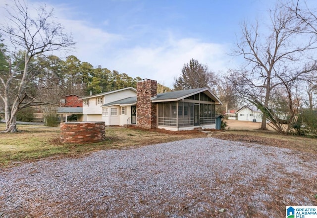 view of front of property with a sunroom