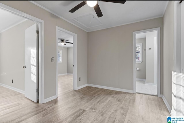 interior space featuring ornamental molding and light wood-type flooring