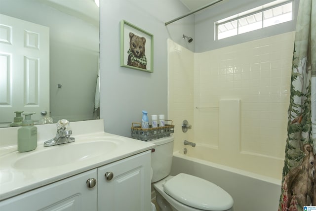 full bathroom featuring vanity, shower / tub combo, and toilet