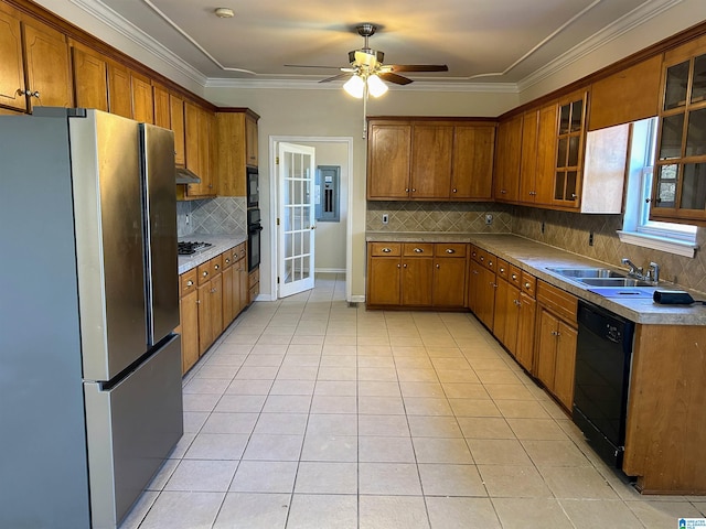 kitchen featuring sink, decorative backsplash, light tile patterned floors, black appliances, and crown molding