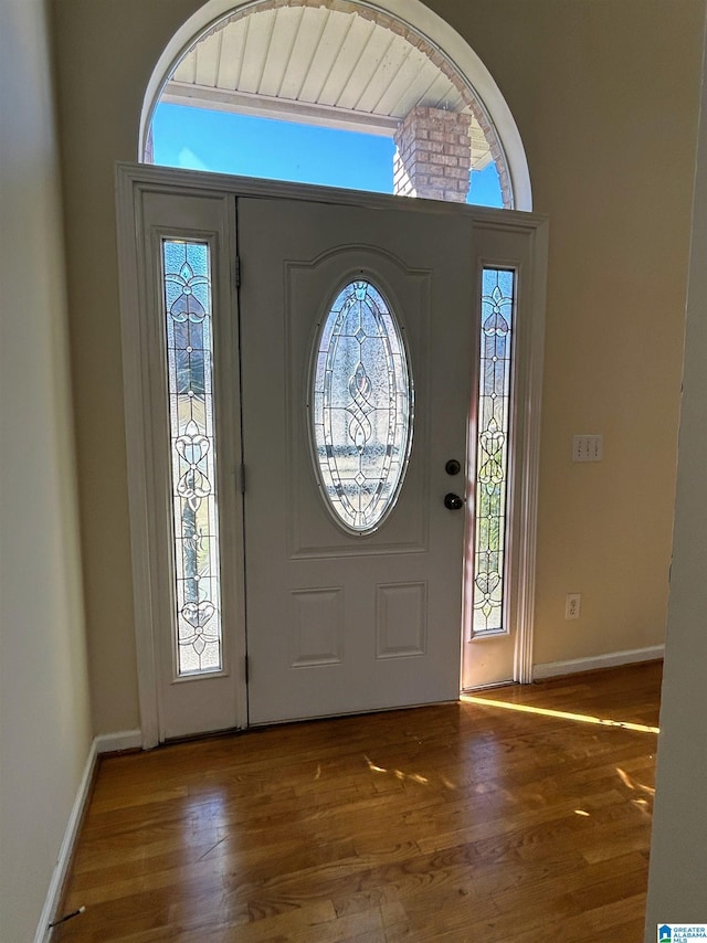 foyer entrance featuring dark hardwood / wood-style flooring