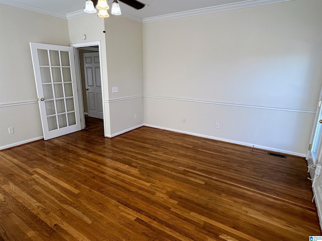 unfurnished room featuring dark hardwood / wood-style flooring, ornamental molding, and ceiling fan