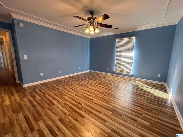 spare room featuring hardwood / wood-style flooring, crown molding, and ceiling fan