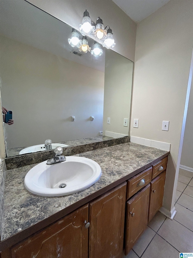 bathroom with tile patterned floors and vanity