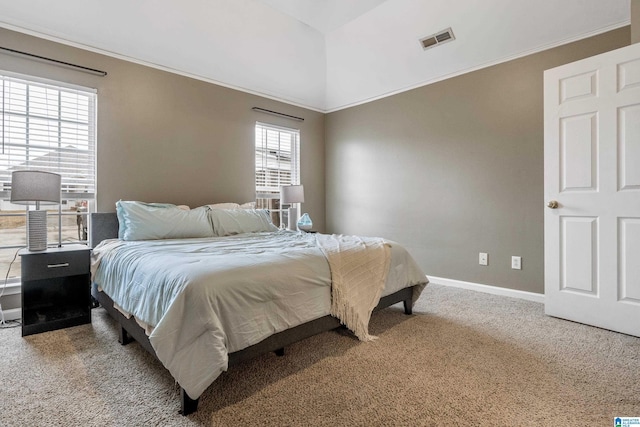 carpeted bedroom with crown molding