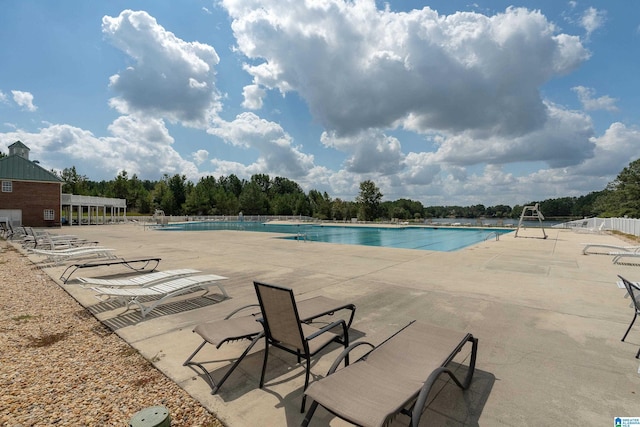 view of swimming pool featuring a patio area