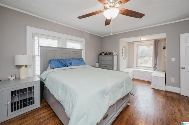 bedroom featuring ornamental molding, dark hardwood / wood-style floors, and ceiling fan