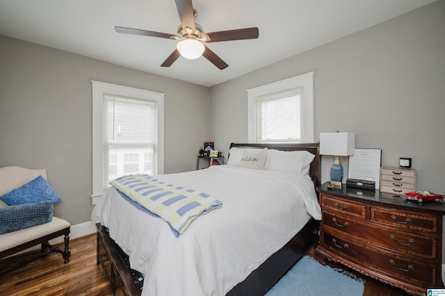 bedroom with dark wood-type flooring and ceiling fan