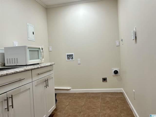 washroom featuring hookup for a washing machine, electric panel, hookup for an electric dryer, and dark tile patterned floors