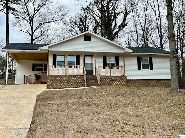 ranch-style home with a carport and a porch