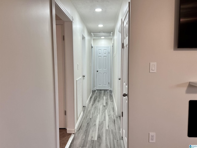 hall with light wood-type flooring