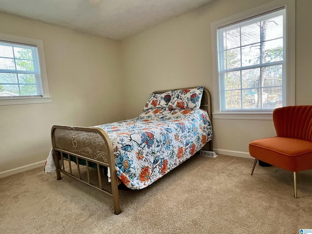 bedroom with light colored carpet