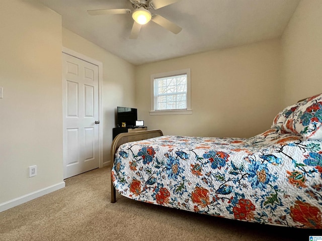 carpeted bedroom featuring ceiling fan