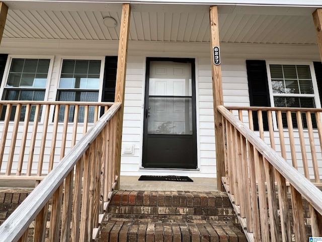 doorway to property featuring a porch