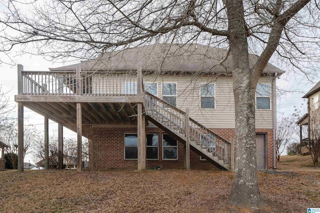 back of house with a wooden deck