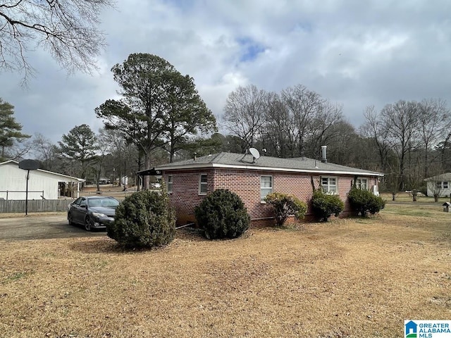 view of property exterior featuring a yard