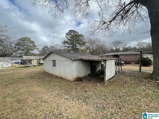 view of property exterior with a trampoline and a lawn