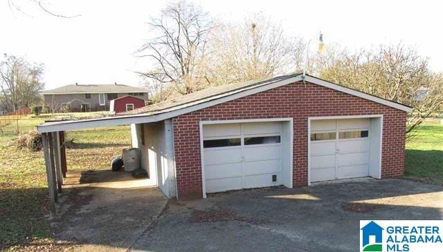 garage featuring a carport