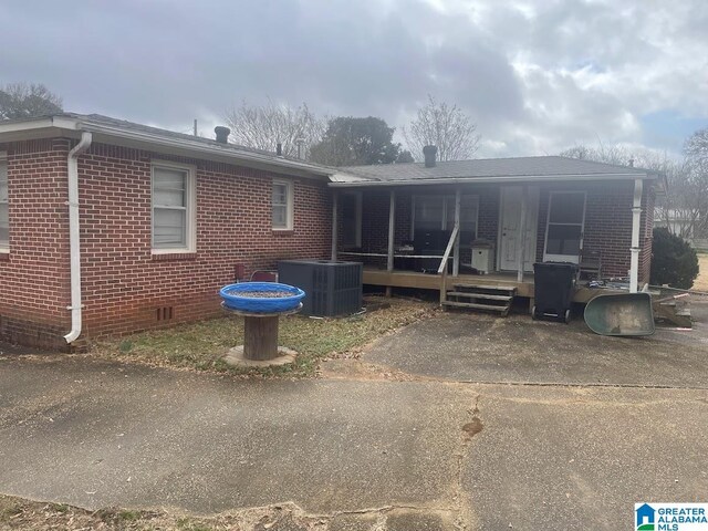 exterior space featuring central AC unit and covered porch