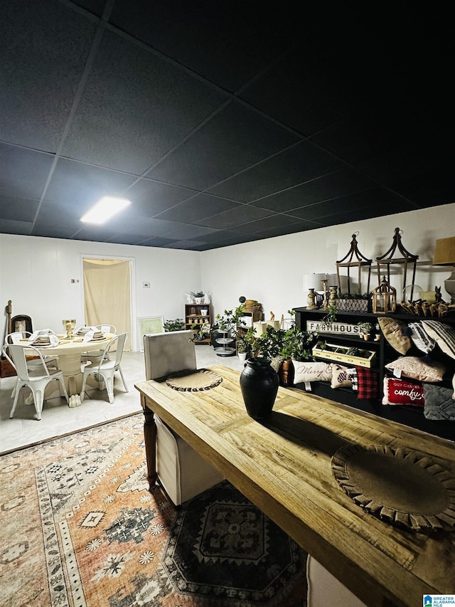 dining space featuring a drop ceiling