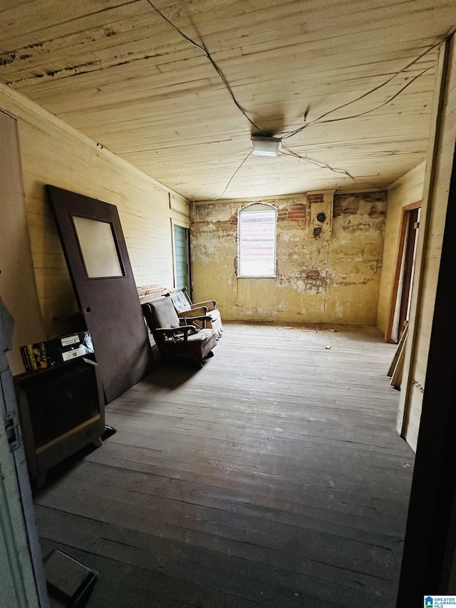 interior space with hardwood / wood-style floors and wood ceiling