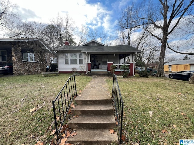 view of front of property featuring a porch and a front lawn