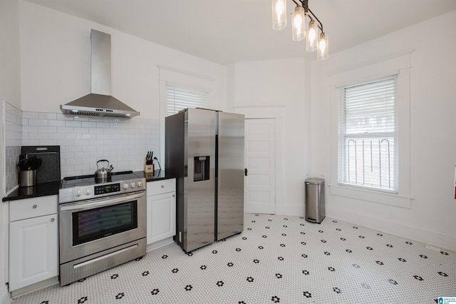 kitchen with white cabinetry, decorative backsplash, range hood, and stainless steel appliances