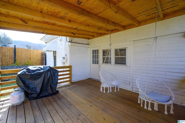 wooden deck with grilling area