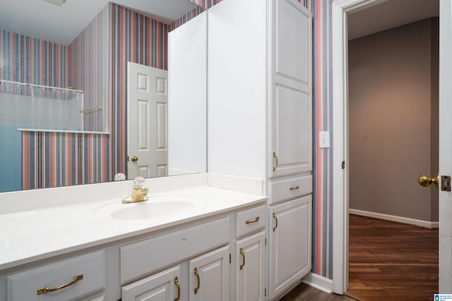 bathroom with vanity and wood-type flooring