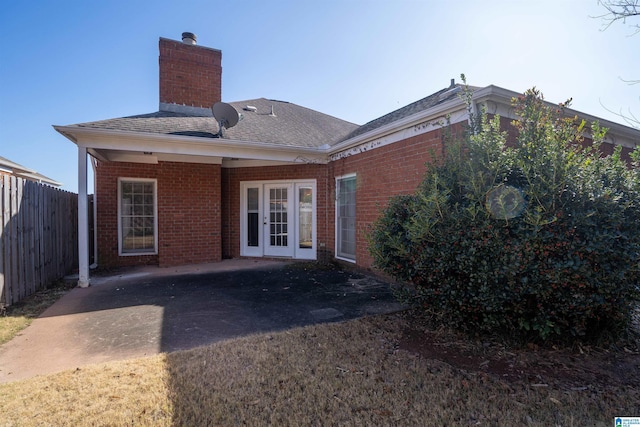 rear view of house with a patio and french doors