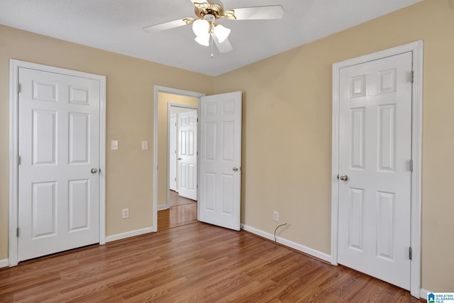 unfurnished bedroom featuring ceiling fan and light hardwood / wood-style flooring