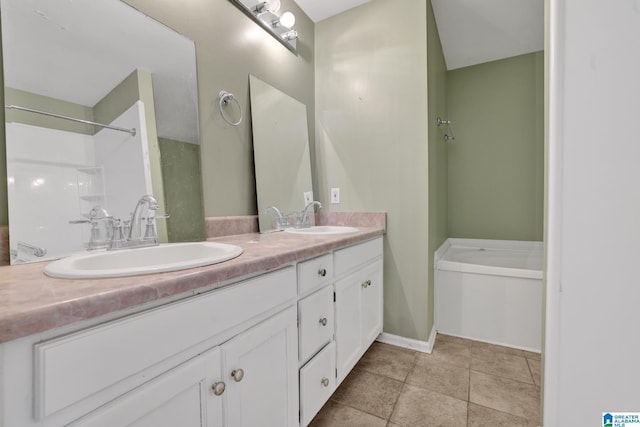 bathroom with tile patterned flooring, vanity, and a tub to relax in