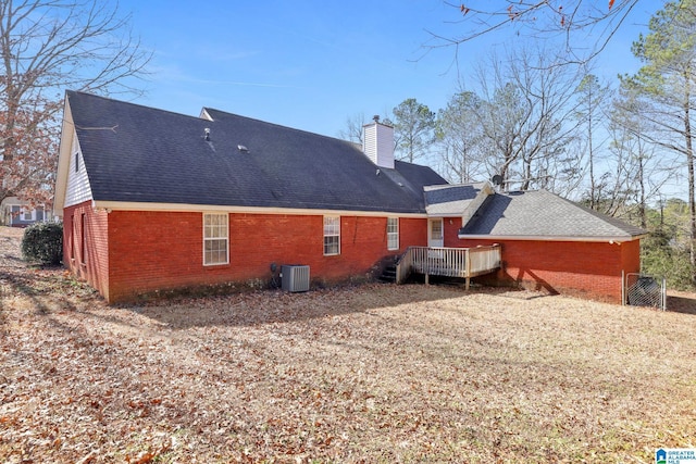 back of property with a deck and central air condition unit