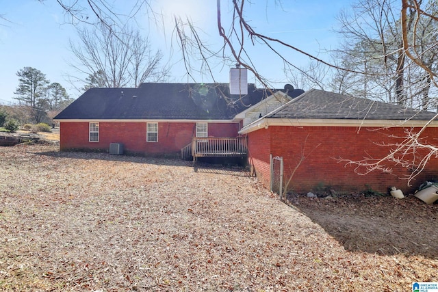 rear view of property featuring central air condition unit