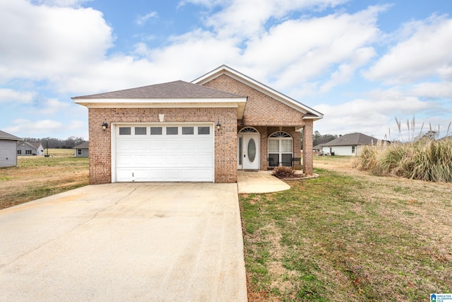 view of front facade featuring a garage and a front lawn