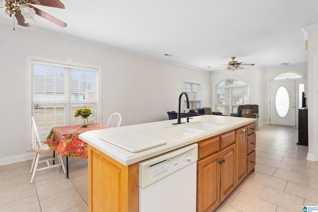 kitchen featuring white dishwasher, sink, a center island with sink, and a wealth of natural light