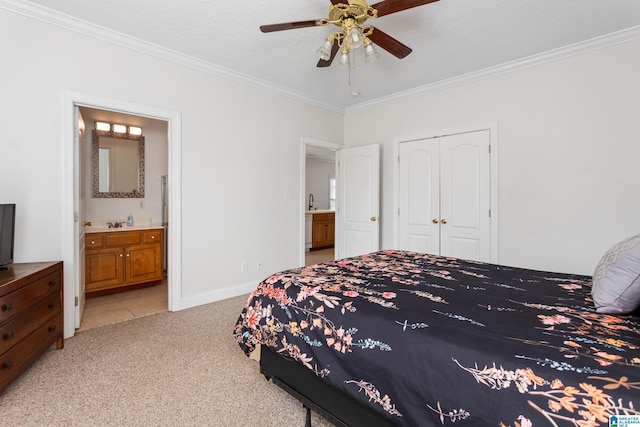 carpeted bedroom featuring connected bathroom, crown molding, a closet, and ceiling fan