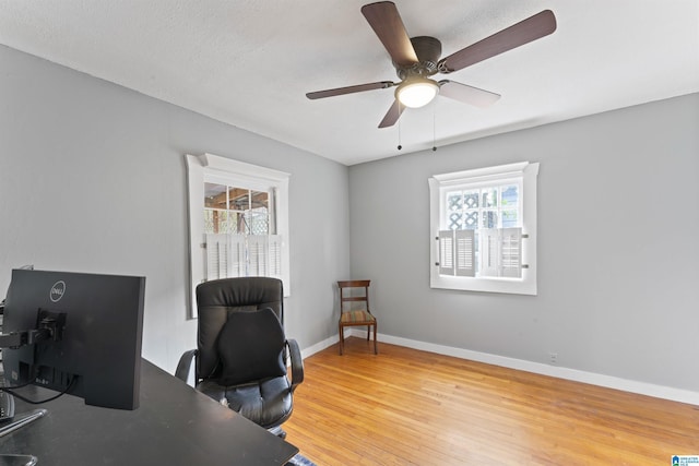 office area featuring wood-type flooring and ceiling fan