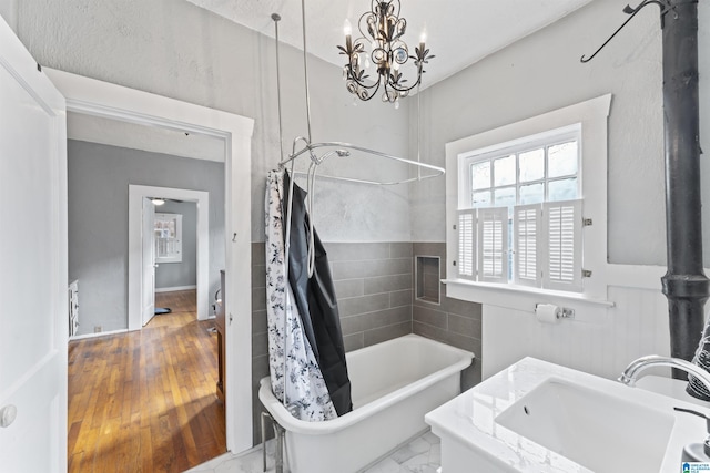 bathroom with vanity and shower / bath combo with shower curtain