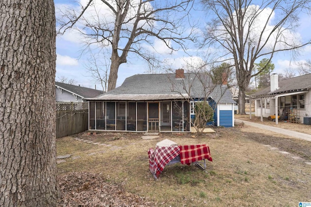 back of property featuring a sunroom