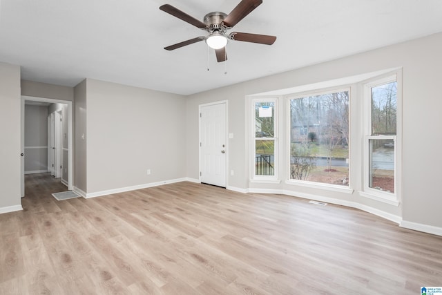 interior space with ceiling fan and light hardwood / wood-style floors