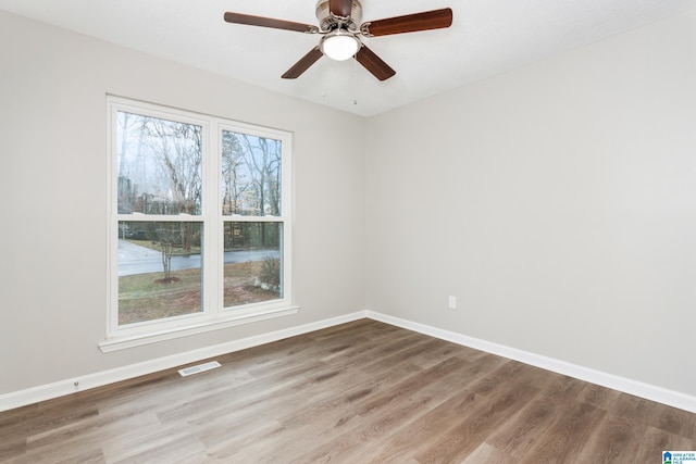 spare room featuring ceiling fan and wood-type flooring