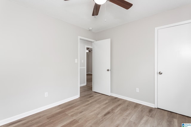 unfurnished bedroom featuring ceiling fan and light hardwood / wood-style flooring