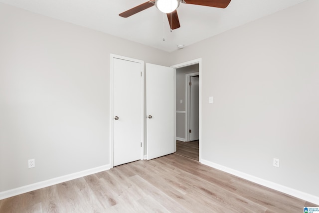 unfurnished bedroom featuring ceiling fan and light wood-type flooring