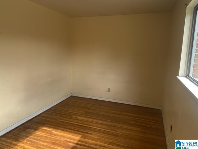 spare room featuring hardwood / wood-style floors